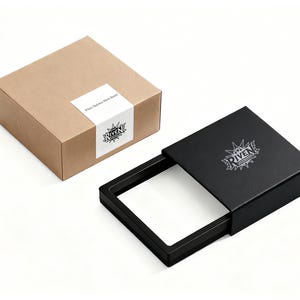 May include: A brown cardboard box with a white label and a black box with a sliding tray. The label on the brown box reads "Where Delicate Minds Bloom". The black box has a logo that says "RIVEN".