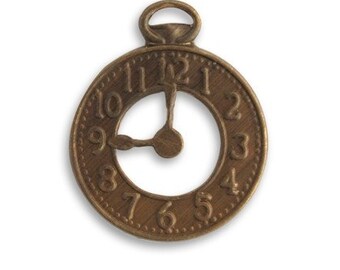 May include: A bronze-colored clock charm with a loop at the top. The clock face has a circular design with numbers 1 through 12. The hands of the clock are positioned at approximately 8:00. The charm is likely for jewelry making or crafting.