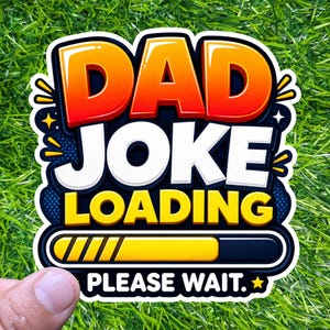 May include: A colorful sticker with the words "DAD JOKE LOADING PLEASE WAIT." The text is in a bold, playful font with orange, red, white, and yellow colors. The background is a dark blue with yellow stars and a loading bar.