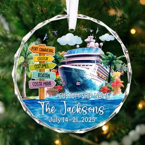 May include: A round, clear ornament with a cruise ship design. The ornament features a cruise ship, palm trees, and directional signs pointing to various ports. Text includes "The Jacksons" and "July 14-21, 2025".