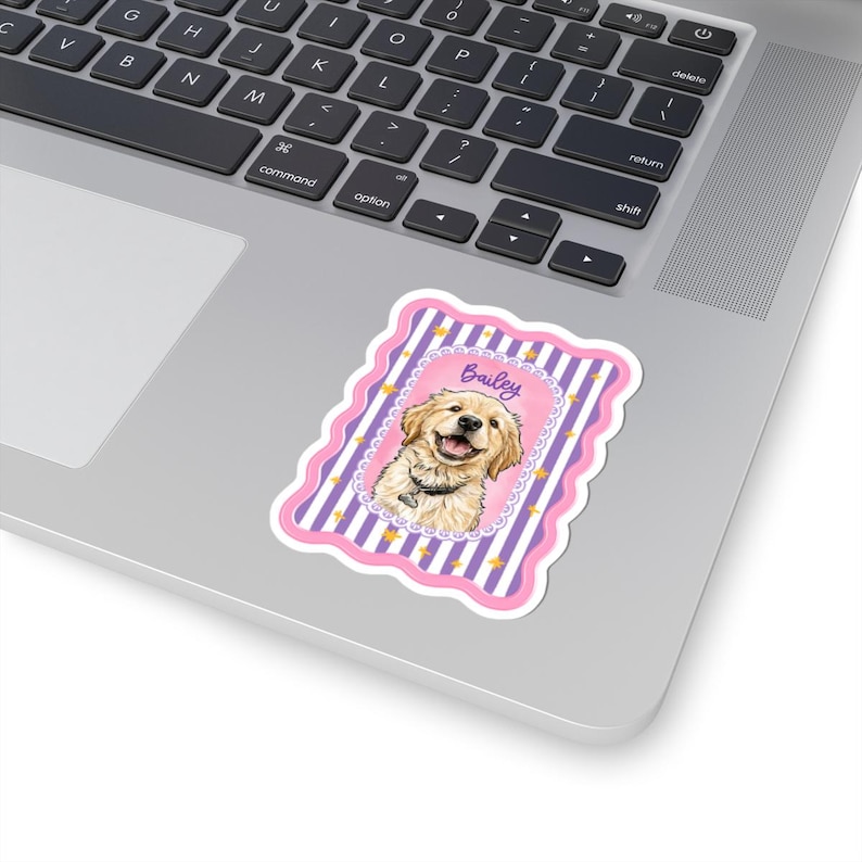 May include: A rectangular sticker with a scalloped pink border featuring a golden retriever illustration centered on a purple and white vertical striped background with small yellow stars and the name Bailey written in purple script above the dog.