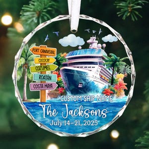 May include: A cruise ship ornament with a tropical theme. The design includes a cruise ship, palm trees, and directional signs pointing to various destinations. The text reads "The Jacksons" and "July 14-21, 2025".