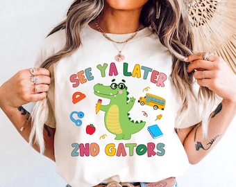 May include: White t-shirt with a green alligator holding a pencil and the text "See Ya Later 2nd Gators" in colorful letters.