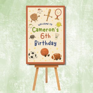 Peut inclure: Panneau d'anniversaire sur chevalet en bois. Le panneau beige avec une bordure marron présente des équipements sportifs de dessins animés et le texte "Bienvenue à Cameron's 6th Birthday."