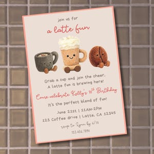 May include: A white ceramic mug with a black handle and the text "But First, Coffee" in a handwritten style. The mug is on a white surface. The mug is likely for hot beverages.