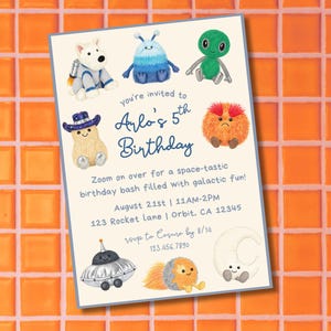 May include: A birthday invitation with a light blue border featuring cartoon space-themed characters. The invitation reads "Arlo's 5th Birthday" with event details. The background is an orange tile pattern.