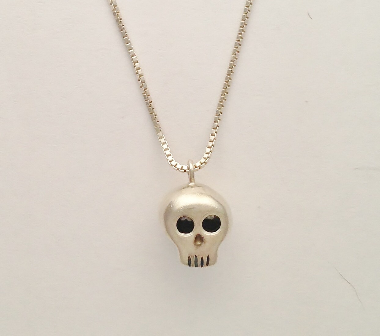 Extremely detailed intricate skull Necklace set with Black Spinel Extremely detailed intricate skull Necklace set with Black Spinel