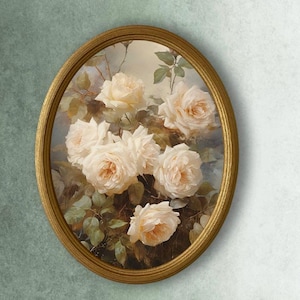 May include: Oval framed painting featuring a bouquet of cream-colored roses with peach centers and green leaves. The gold frame surrounds the floral artwork, creating a classic aesthetic. The painting is set against a soft, neutral background.