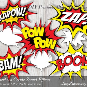 May include: Printable superhero comic sound effect photo booth props. The props feature red and yellow speech bubbles with the words "KAPOW!", "BAM!", "POW POW", "ZAP!" and "BOOM!"