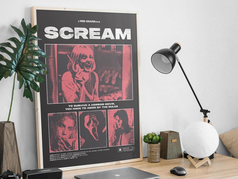 May include: A framed movie poster for the film "Scream" with a black background and red and white text and images. The poster includes the text "SCREAM" and "TO SURVIVE A HORROR MOVIE, YOU HAVE TO ABIDE BY THE RULES."