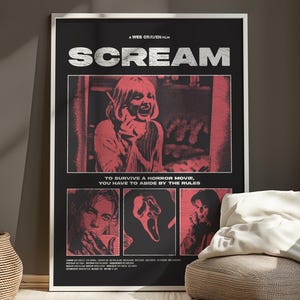 May include: A framed movie poster for the film "Scream" with a black background and red and white graphics. The poster features the film's title, images from the movie, and the text "TO SURVIVE A HORROR MOVIE, YOU HAVE TO ABIDE BY THE RULES."