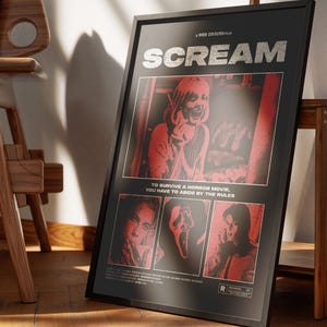 May include: Framed black poster for the movie "Scream" with red and white graphics. The poster features the movie title, images of characters, and the text "TO SURVIVE A HORROR MOVIE, YOU HAVE TO ABIDE BY THE RULES."