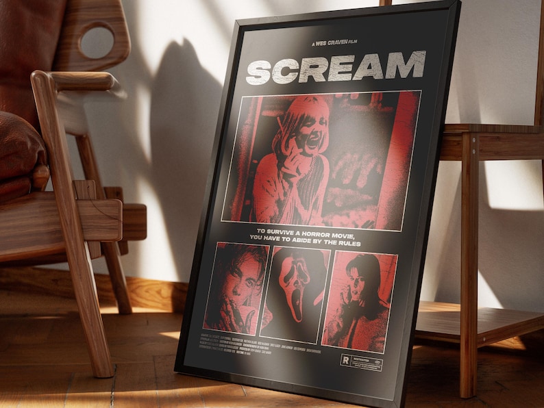 May include: Framed black poster for the movie "Scream" with red and white graphics. The poster features the movie title, images of characters, and the text "TO SURVIVE A HORROR MOVIE, YOU HAVE TO ABIDE BY THE RULES."