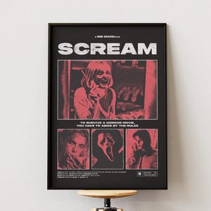 May include: Black framed movie poster for the film "Scream". The poster features the title in large white letters, with red and black images of characters from the movie. The text "TO SURVIVE A HORROR MOVIE, YOU HAVE TO ABIDE BY THE RULES" is also included.