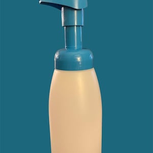 May include: A white plastic bottle with a blue pump dispenser. The bottle is designed for dispensing foam.