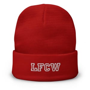 May include: Red knit beanie with a white embroidered logo that says "LFCW".