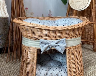 Handwoven wicker pet bed with cushions, made from natural willow using traditional weaving techniques