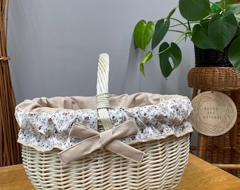Handwoven wicker basket with cotton liner, made from raw natural willow using traditional techniques