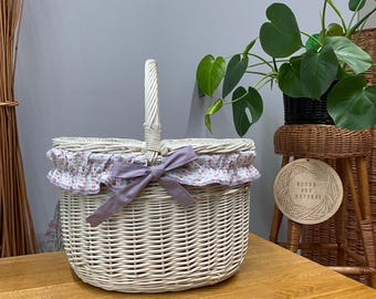 Handwoven wicker basket with lid and cotton liner, made from natural willow using traditional techniques