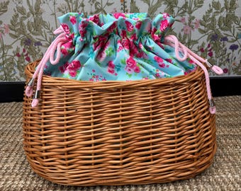 Handwoven wicker bike basket with floral liner