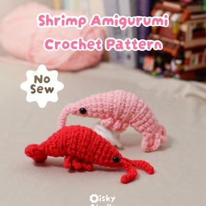 May include: Two crocheted shrimp amigurumi, one light pink and one bright red, each with small black bead eyes. A white star-shaped graphic reads No Sew. The text Shrimp Amigurumi Crochet Pattern and the Oisky Studio logo are visible.