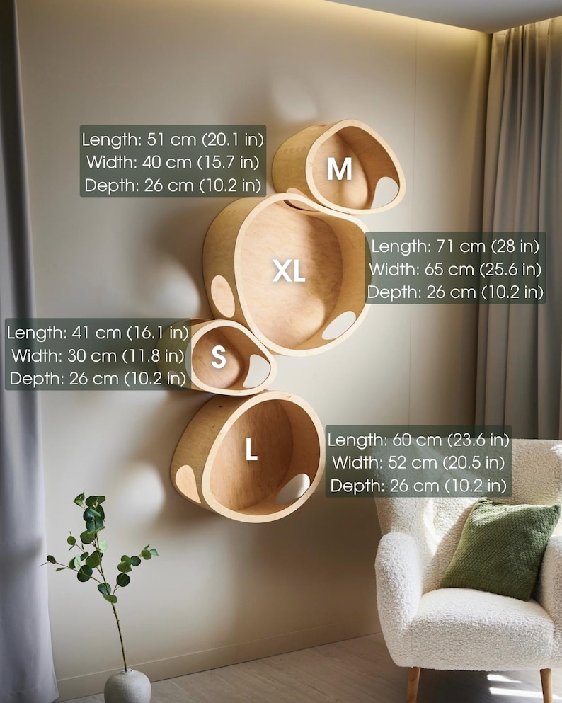 May include: A set of four wooden wall shelves in varying sizes (S, M, L, XL). The shelves are light brown and have a rounded, organic shape. Measurements are provided in inches and centimeters. The XL shelf is 28 inches long.