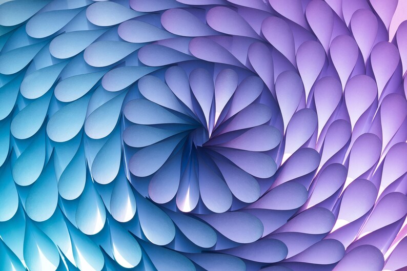 May include: A swirling pattern of blue and purple paper, creating a spiral effect. The paper is folded into teardrop shapes, creating a textured and abstract design.