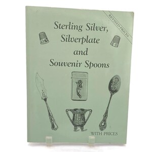 May include: A light green book cover titled Sterling Silver, Silverplate and Souvenir Spoons with the text Revised Prices and With Prices. The cover features illustrations of two thimbles, a knife, a rectangular case, and a spoon.