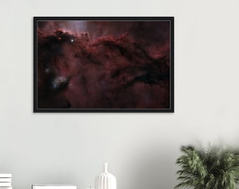 May include: A close-up of a nebula in space, with a dark, swirling cloud of gas and dust. The nebula is a deep red color, with some areas of lighter pink and white. There are a few bright stars visible in the nebula.