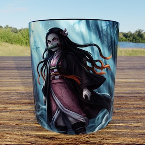May include: A cylindrical drinking glass featuring a vibrant, full-colour graphic illustration of a long-haired character with a bamboo muzzle, wearing a pink patterned kimono and a dark outer robe, set against a dark, misty forest background.