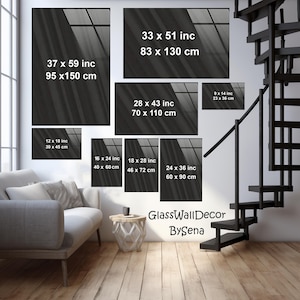 May include: A set of black and white abstract wall art prints with different sizes and dimensions. The prints feature a blurred image of a window with light streaming through it. The prints are labeled with their dimensions in inches and centimeters. The text "GlassWallDecor BySena" is at the bottom of the image.