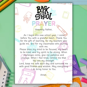 May include: A printed Back to School Prayer card with a colorful design. The card features the text "Back to School Prayer" in a playful font, along with a prayer. The background is decorated with school-themed doodles.