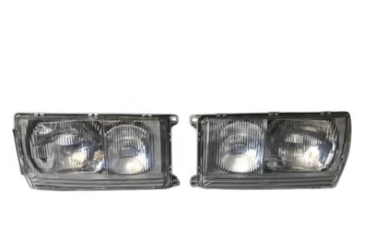 a pair of clear headlight fixtures against a white background.