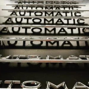 Mercedes-Benz W107 W115 W116 &#39;AUTOMATIC&#39; Badge  OEM Numbers: A1128170615