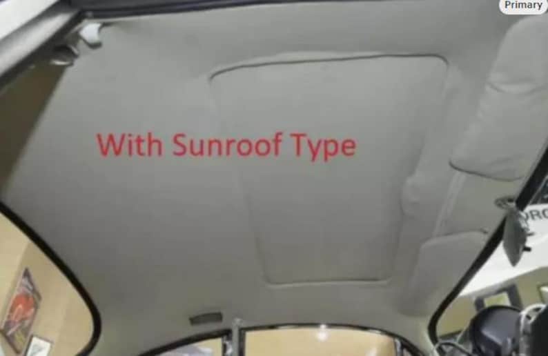 the interior of a car, specifically the sunroof area.