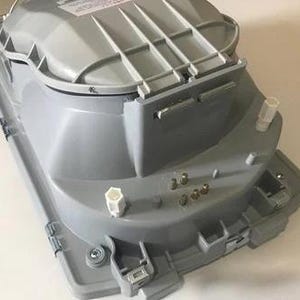 a gray electronic device with various components and connectors, including a power supply and a control panel.