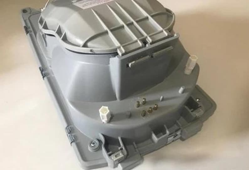 a gray electronic device with various components and connectors, including a power supply and a control panel.