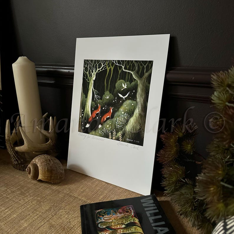 May include: A print of a dark forest scene with three red foxes running through the trees. The print is titled "The Guardians" and signed by the artist, "Danielle Clark".