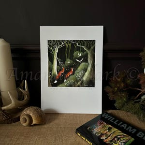 May include: A print of a painting depicting a woman standing in a dark forest with three foxes and birds flying overhead. The text "Waiting for Dawn" is written at the bottom of the print.