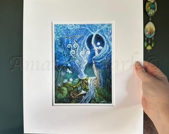 May include: A blue and green watercolor painting of a woman standing in a forest. She is holding a bowl with smoke rising from it. The woman is surrounded by trees and flowers. The painting is framed in a white mat.