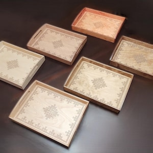 May include: A white ceramic mug with a black handle and the text "But First, Coffee" in a handwritten style. The mug is on a white surface. The mug is approximately 4 inches tall.