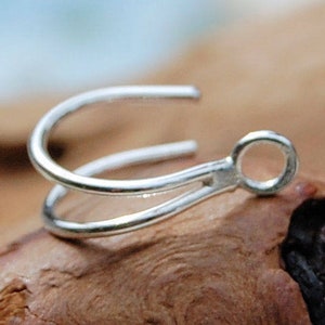 May include: Silver double loop earring finding with a small loop at the end.