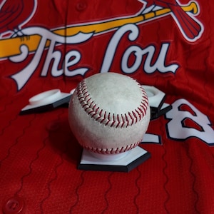 May include: A set of three ceramic mugs with a speckled, matte finish. The mugs are in shades of cream, light gray, and dark gray. Each mug has a simple, minimalist design, perfect for coffee or tea.