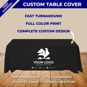 May include: A black custom table cover with a white logo and the text "YOUR LOGO SLOGAN OR TAGLINE". The cover has the text "CUSTOM TABLE COVER", "FAST TURNAROUND", "FULL COLOR PRINT", and "COMPLETE CUSTOM DESIGN". It also says "PREMIUM QUALITY", "FULLY WASHABLE", "POLYSTER FABRIC", and "SCRATCH RESISTANT".
