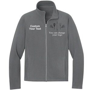 May include: A gray fleece jacket with a full zipper and a stand-up collar. The jacket has the text "Custom Your Text" on the left chest and "You can change your logo" with baking-themed graphics on the right chest.