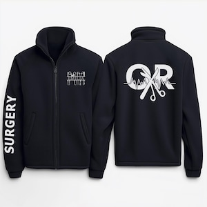 May include: Black fleece jacket with a white zip and a white graphic on the back that says "OR" with a heartbeat and surgical scissors. The left sleeve has the word "SURGERY" printed vertically in white.