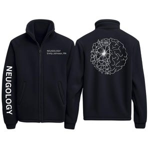 May include: Black zip-up fleece jacket. The left sleeve has the word "NEUGOLOGY" printed vertically. The front has the text "NEUGOLOGY Emily Johnson, RN". The back features a white floral and brain design.