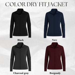May include: A display of four Dry Fit jackets in black, navy, charcoal gray, and burgundy. Each jacket has a full-length zipper and a stand-up collar. The text "COLOR DRY FIT JACKET" is at the top of the image.