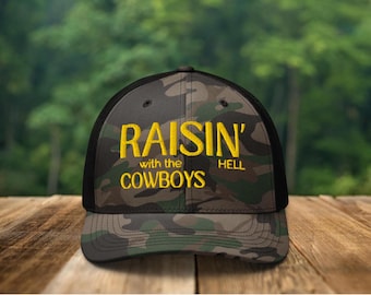 Embroidered Raisin Hell With The Cowboys Camo Hat, raisin hell hat, raisin hell trucker hat, cowboy hat, rodeo hat, cowgirl hat, western hat