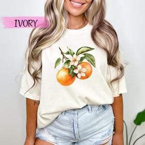Vintage shirt met oranjebloesem, comfortabele kleuren, T-shirt met fruitprint, T-shirt met botanische citrus, shirt zomertuin, zacht esthetisch retro T-shirt